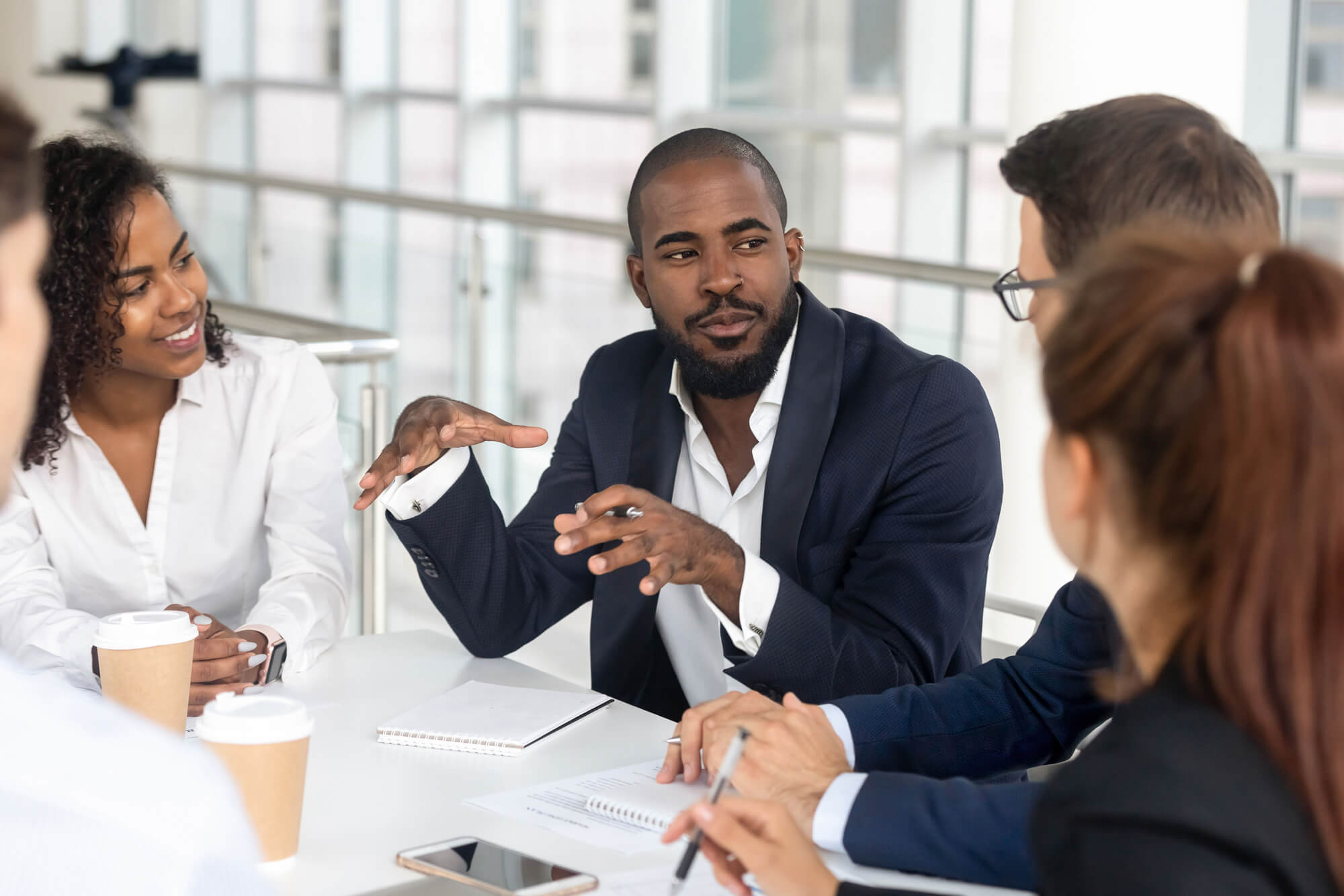 rra-black-millennial-boss-leading-corporate-team-iStock-1139630453.jpg